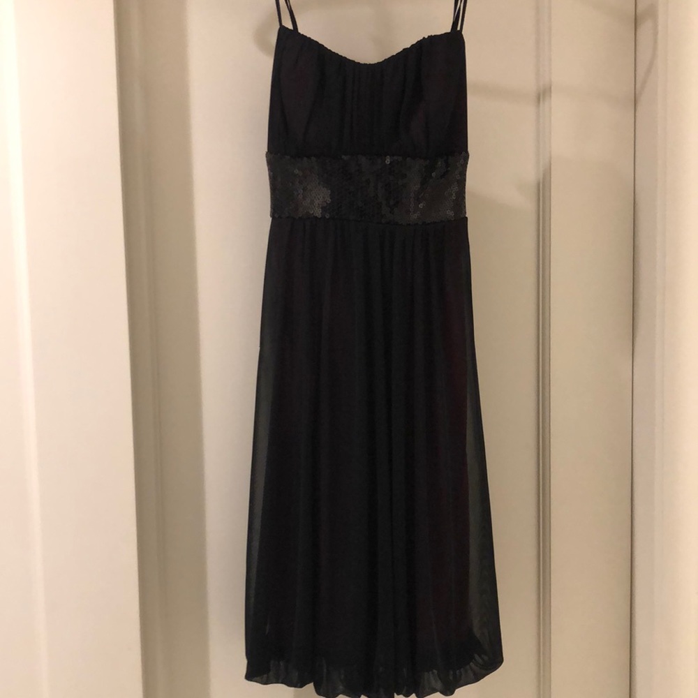purple and black mesh Trixxi dress with black sequins, padded bodice and a bow